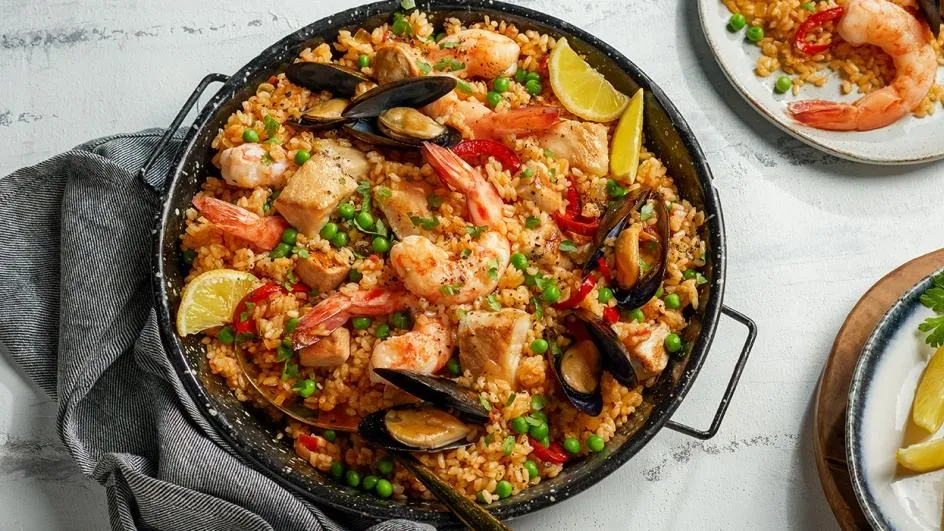 {'en': 'Eat paella and control glucose', 'es': 'Comer Paella y controlar la glucosa'} Image